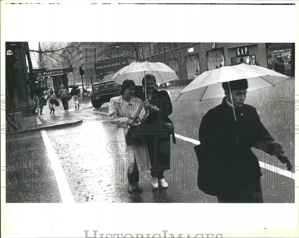 1992 People walking in Chicago&#39;s Rain - Historic Images