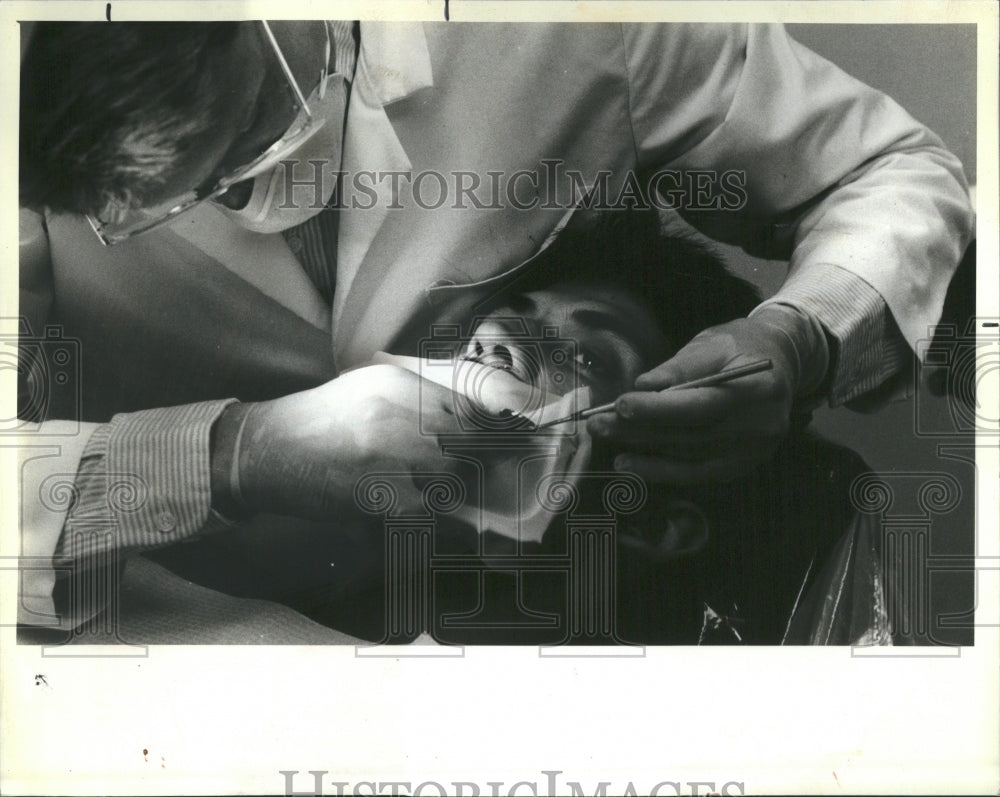 1987 Dental Student Masked Working Patient - Historic Images