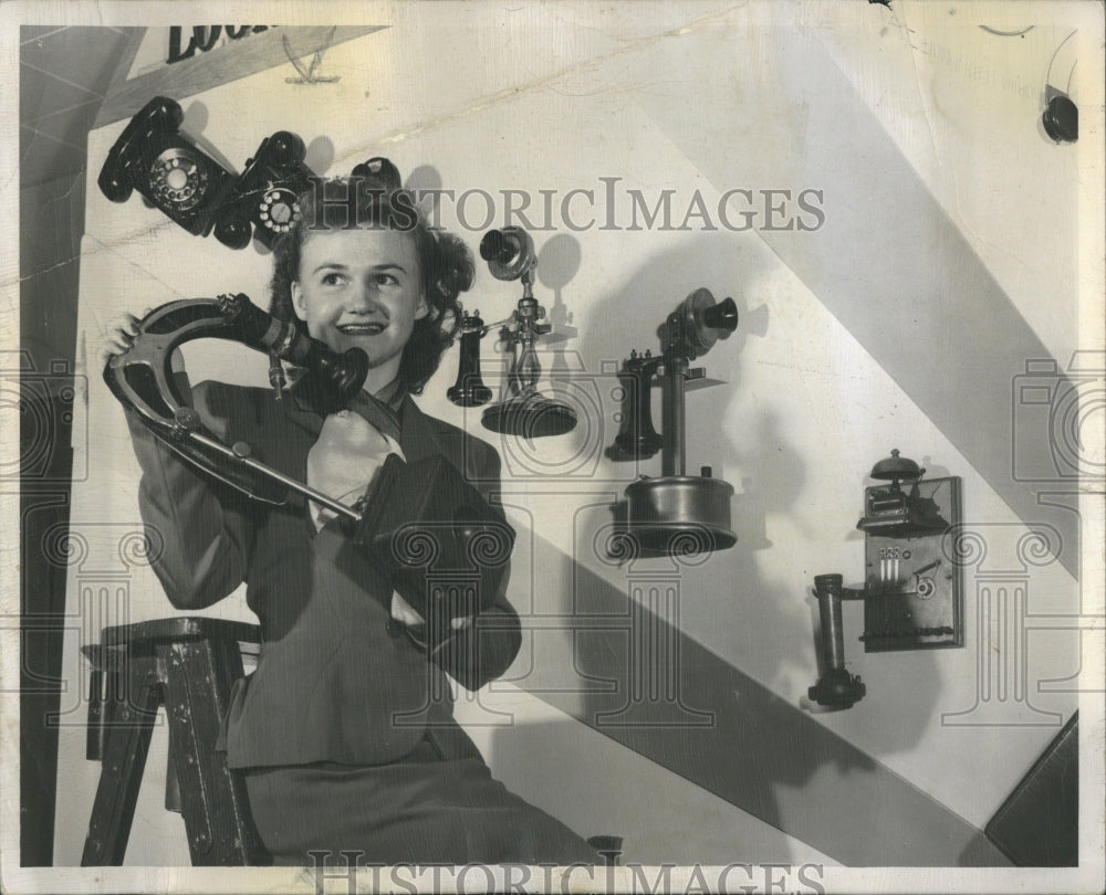 1950 Gene Panto examining the object - Historic Images