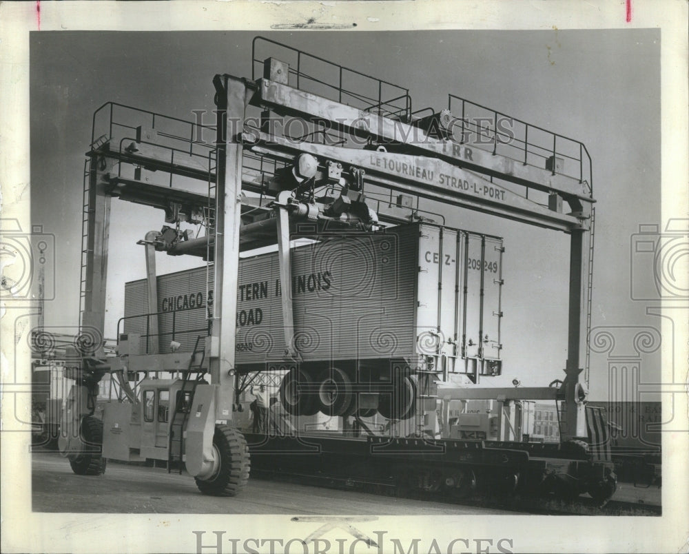 1964 crane lifting an 18-wheel truck - Historic Images
