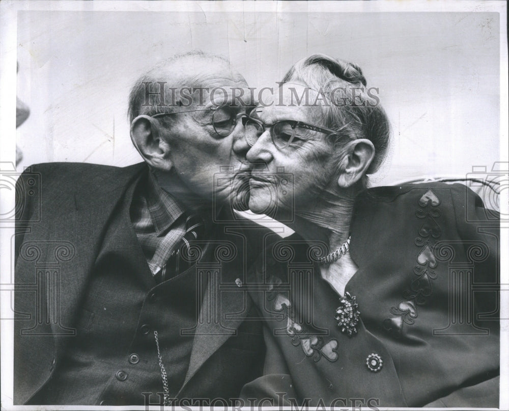 1965 Seniors kissing at nursing home - Historic Images