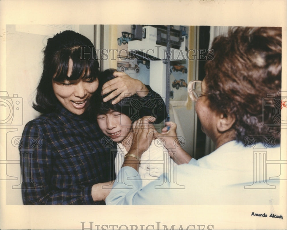1991 Immunization Shot Child Winces Nurse - Historic Images