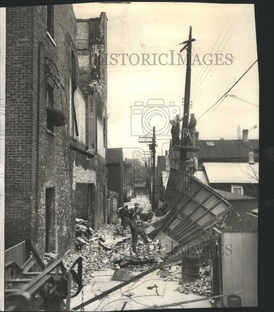 1957 Press Photo Wind Blows Down Brick Valley Rubble - Historic Images