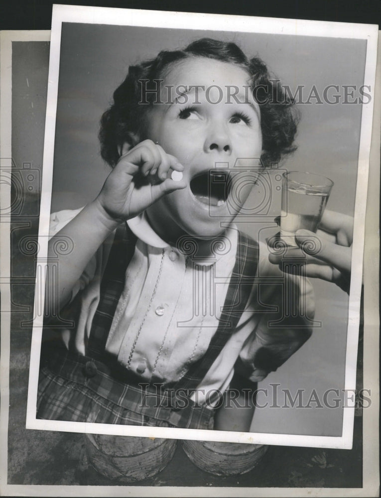  Child Enthusiastically Takes Her Medicine - Historic Images