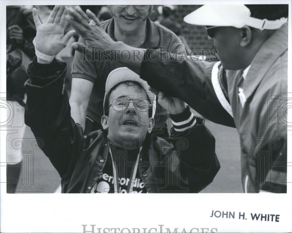 1993 Press Photo Special Olympics Player High Fives