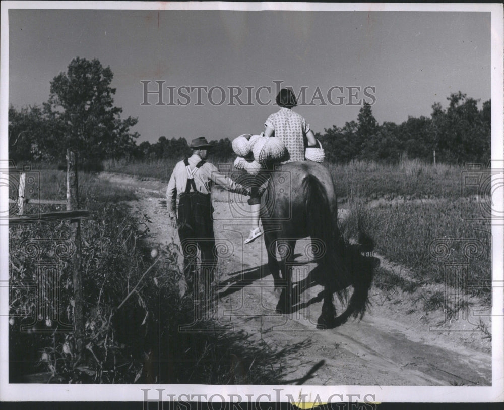 1954 Press Photo Baskets Day Going Market Father Pete