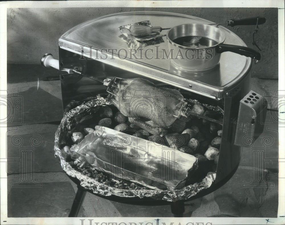 1970 Press Photo Duckling Roasting on a Split