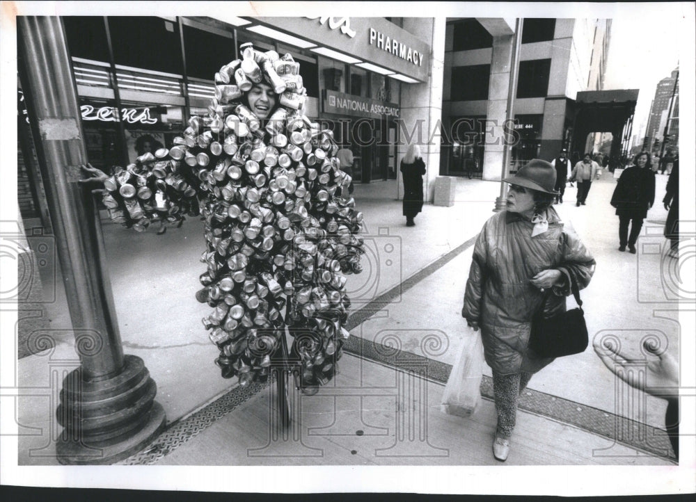 1992 Press Photo Man on bike wearing suit made of cans