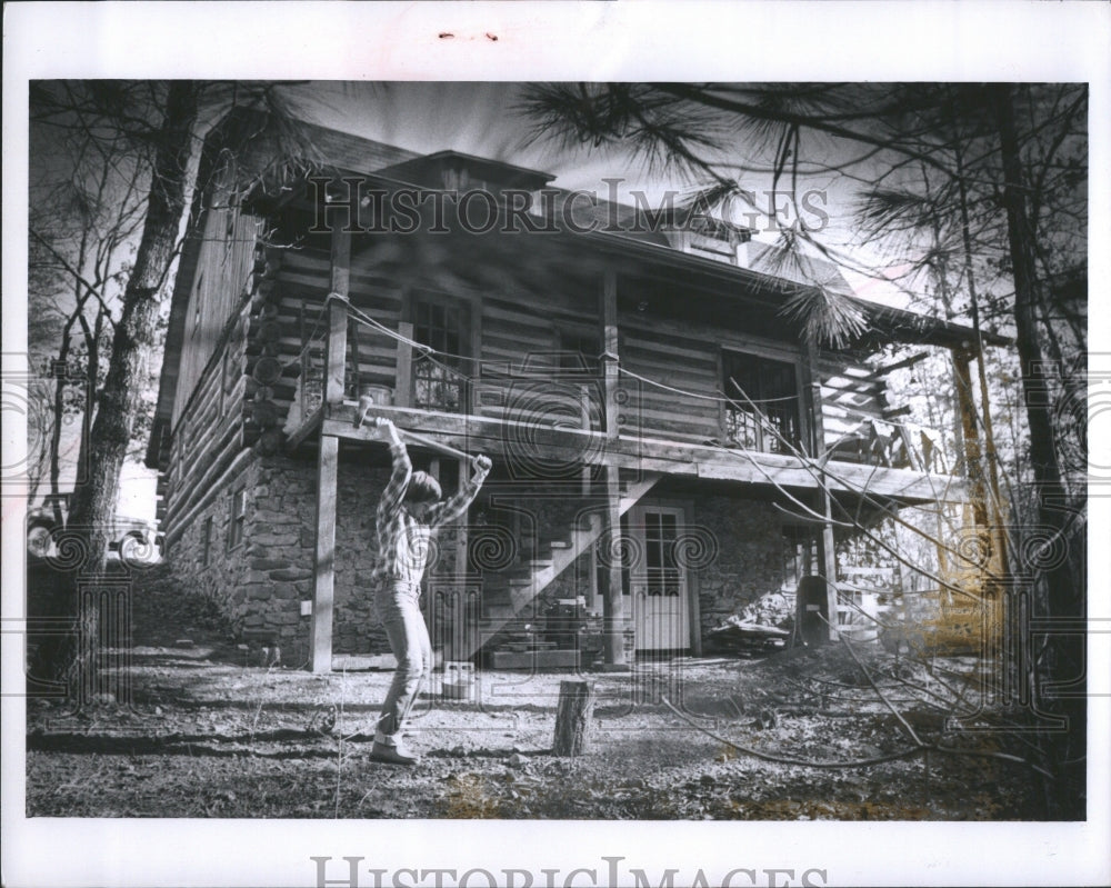 1978 Press Photo Allen chops wood in yard.