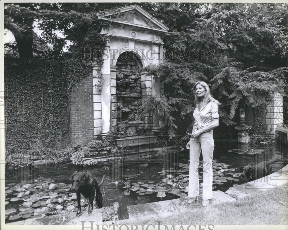 Press Photo Woman Pool Ground Dog Animal Trees