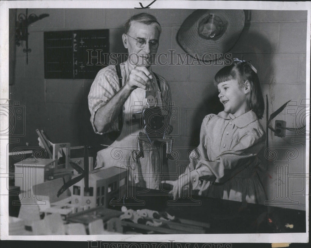 1948 Press Photo Girl and Toy Maker