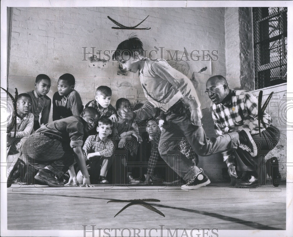 1962 Press Photo Kids at play with adult