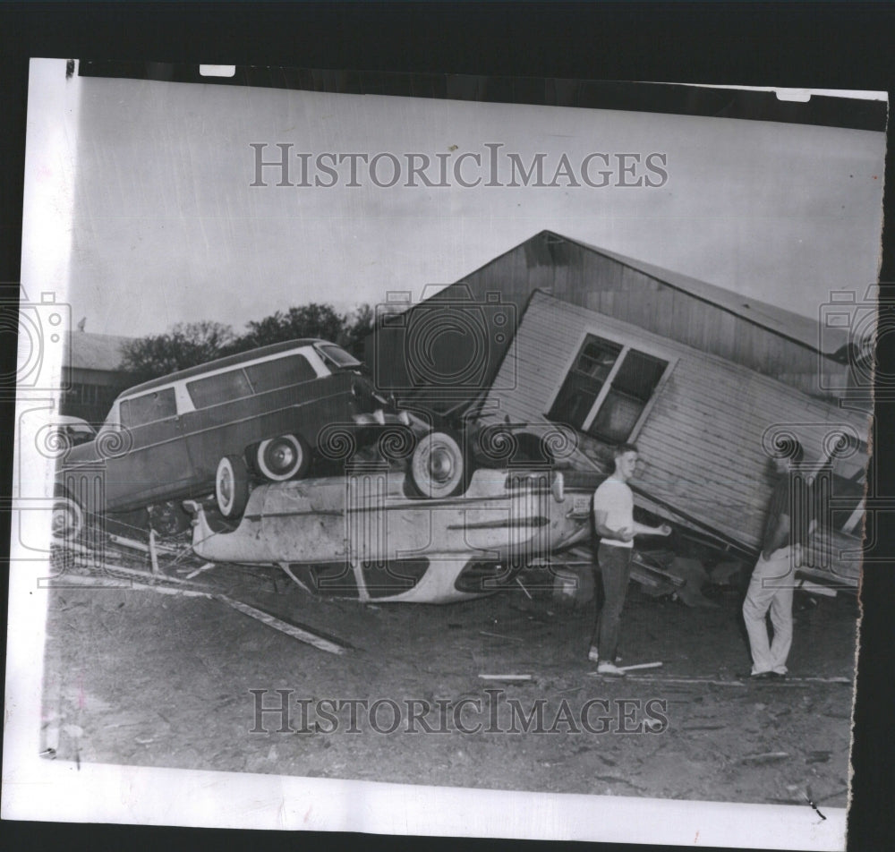 1957 Press Photo Upended Camera Shop Piled Fierce Winds