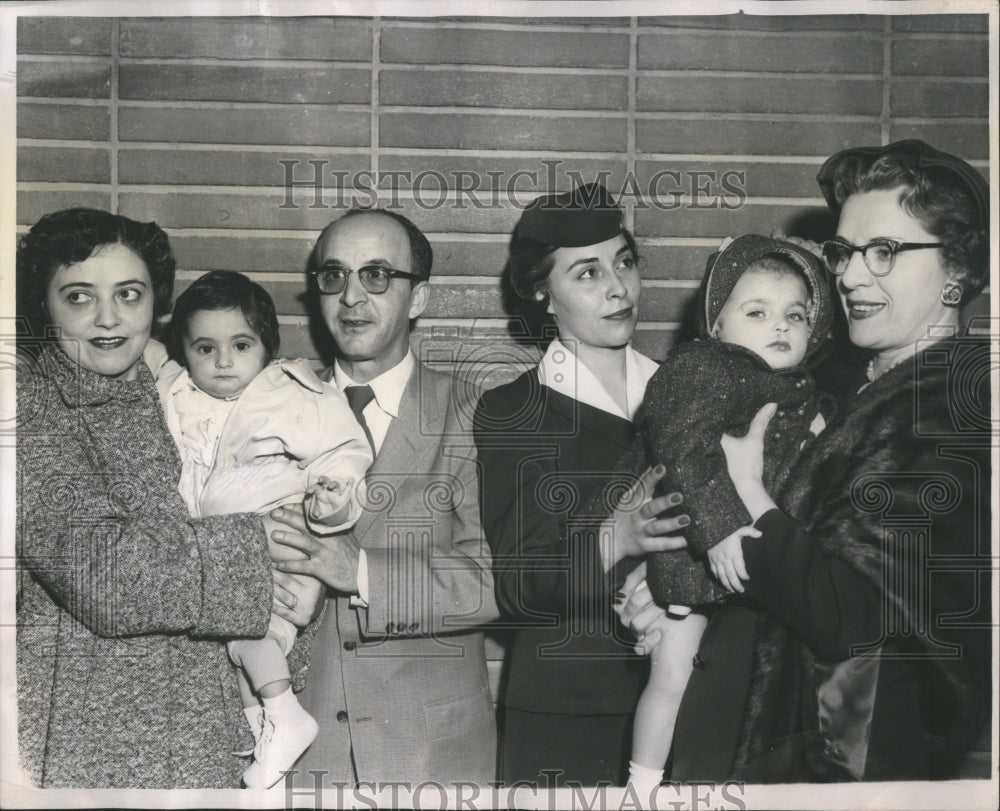 1957 Press Photo Orphans adopted by their new family