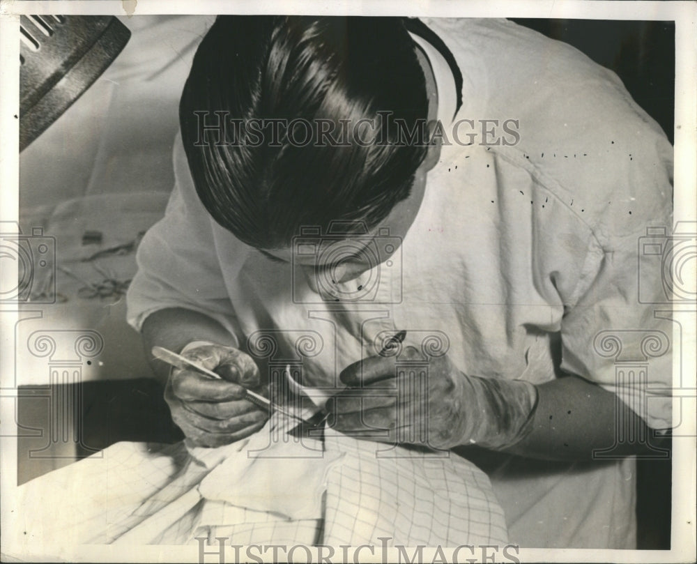 1939 Press Photo Doctor Removes Bit Fissue Suspected