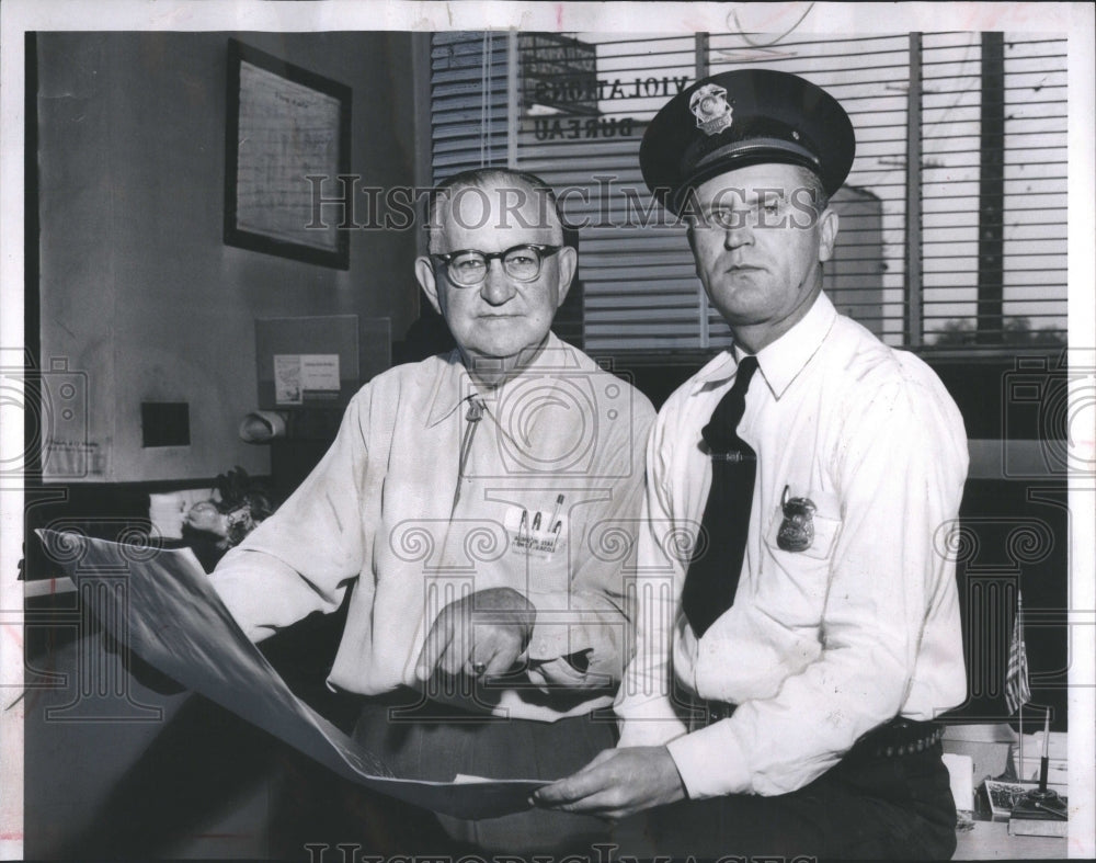 1957 Press Photo City Clerk Ed Havai Utica Police