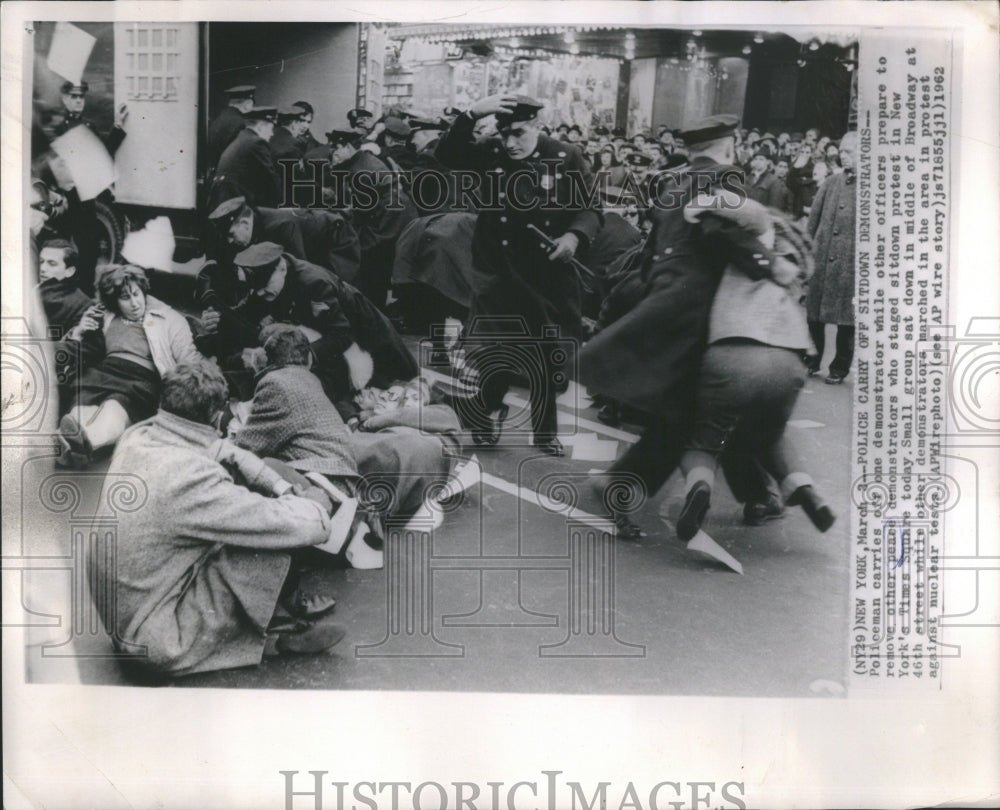 1962 Press Photo Policeman Carries Demonstrator Officer