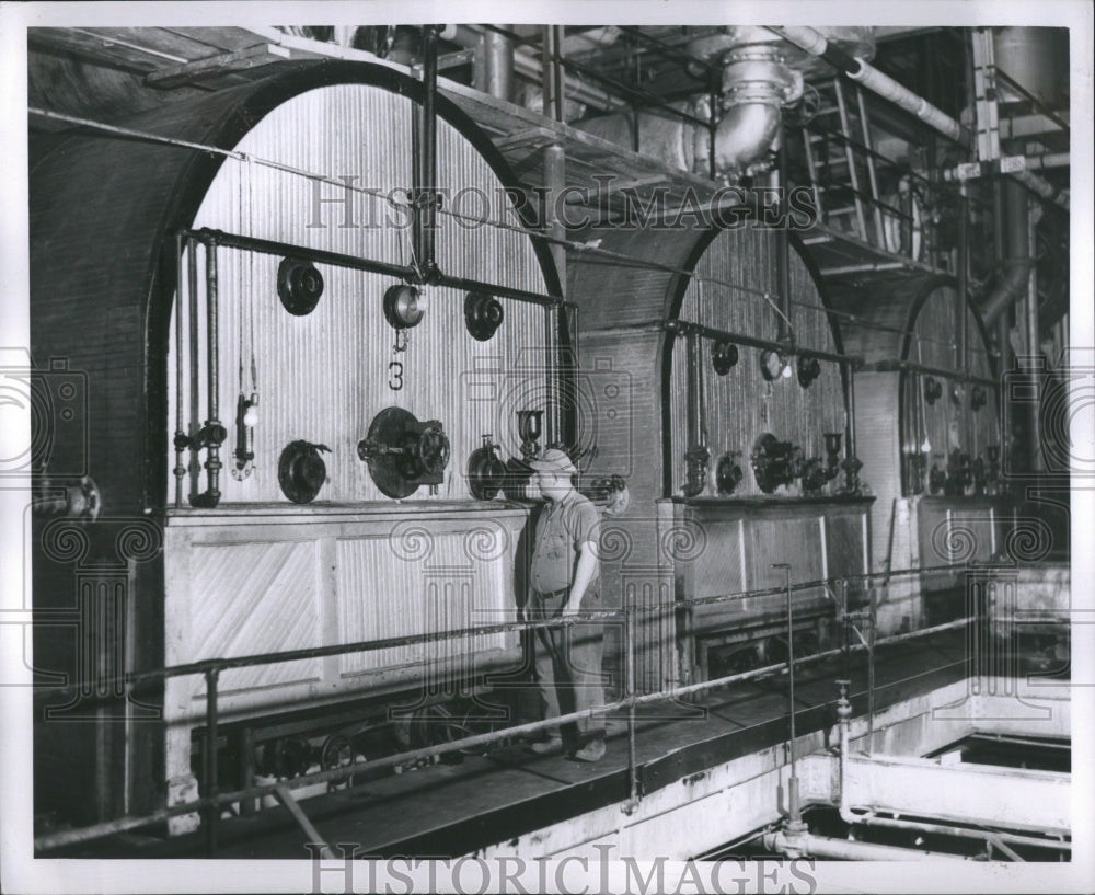 1950 Press Photo Inspecting a Syrup Evaporator