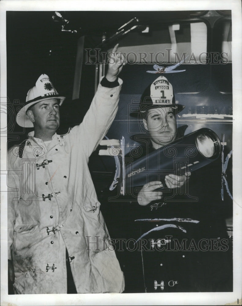 1965 Press Photo Two Men with Light