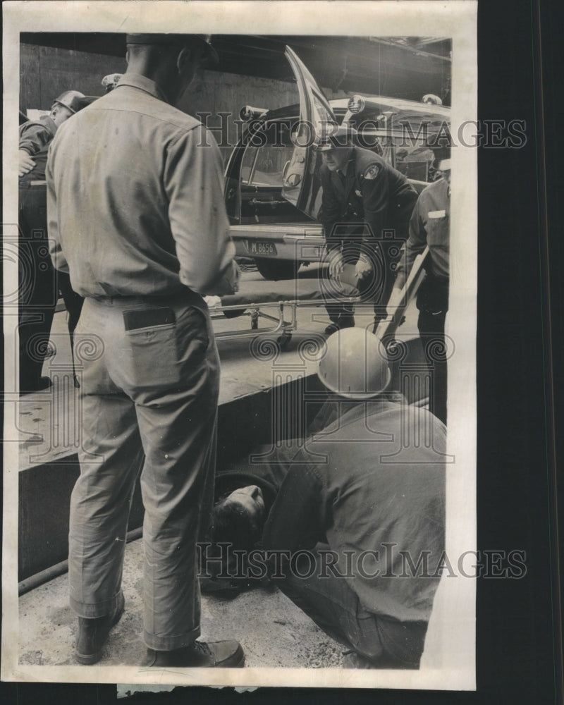 1962 Press Photo U.S. Gypsum worker hit falling beam