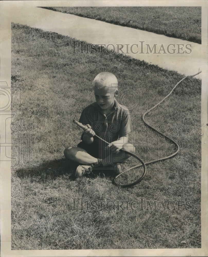 1963 Press Photo Water Shortage Leads Lawn Watering Ban