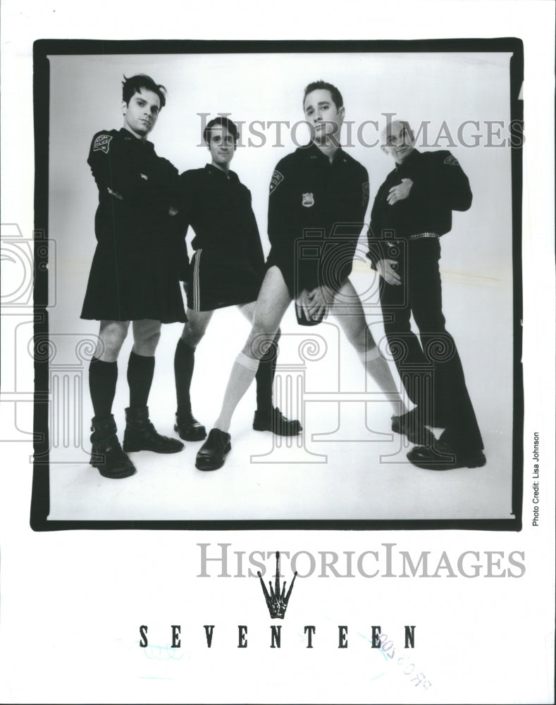 Press Photo Music Group Police Uniforms Posing