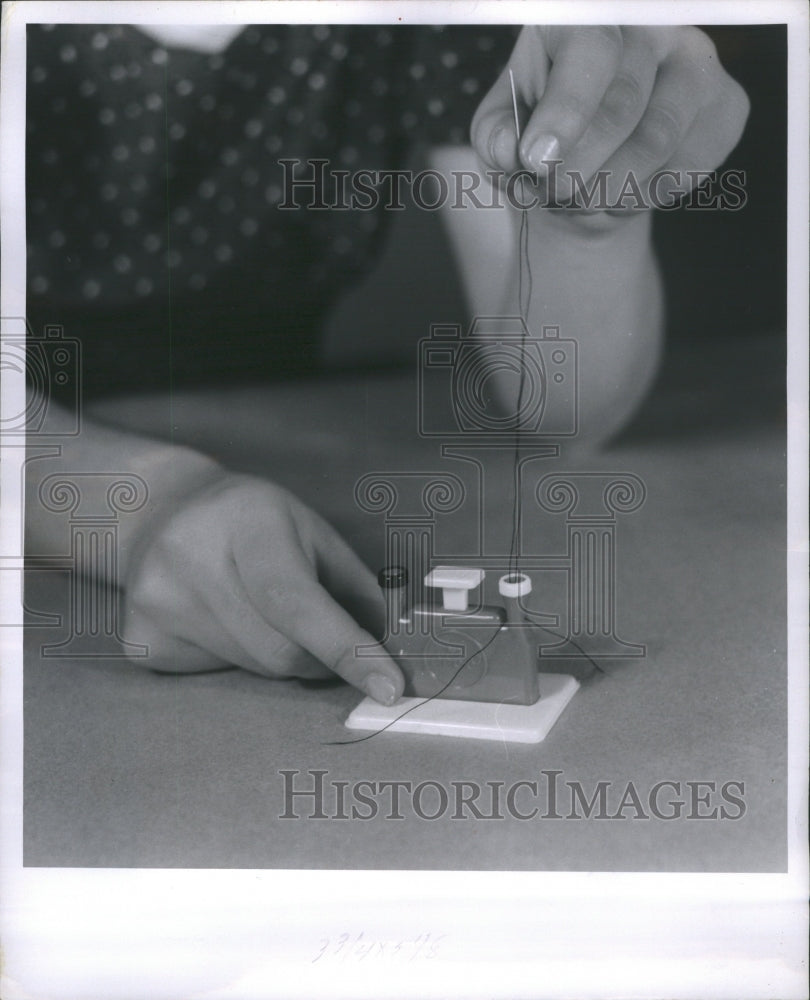 1960 Press Photo Sewing Needle Lifted Shaft Stitching