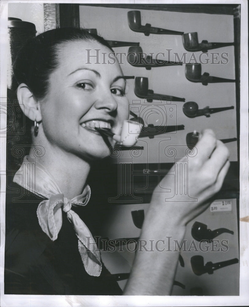 1954 Press Photo Smoking pipes