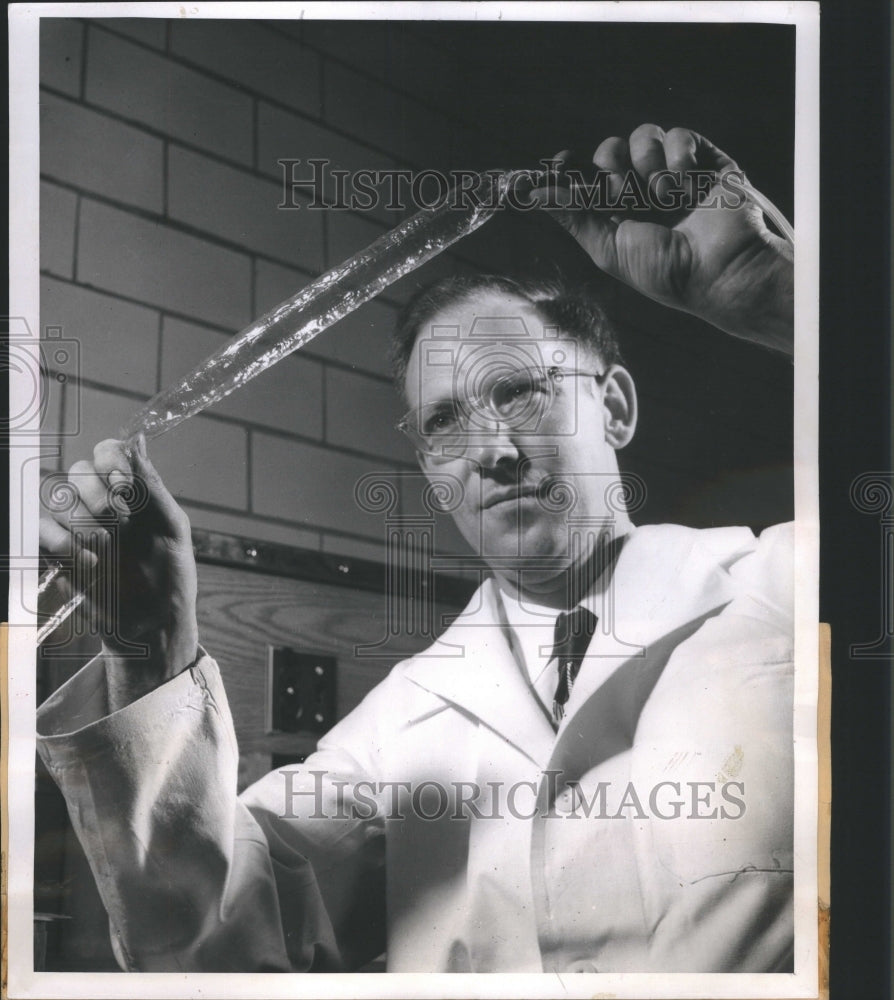 1952 Press Photo Barker examined plastic tubing