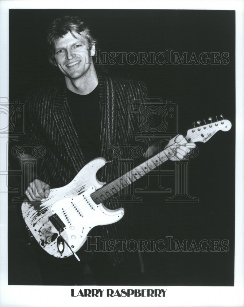 1956 Press Photo Larry Raspberry holding his guitar