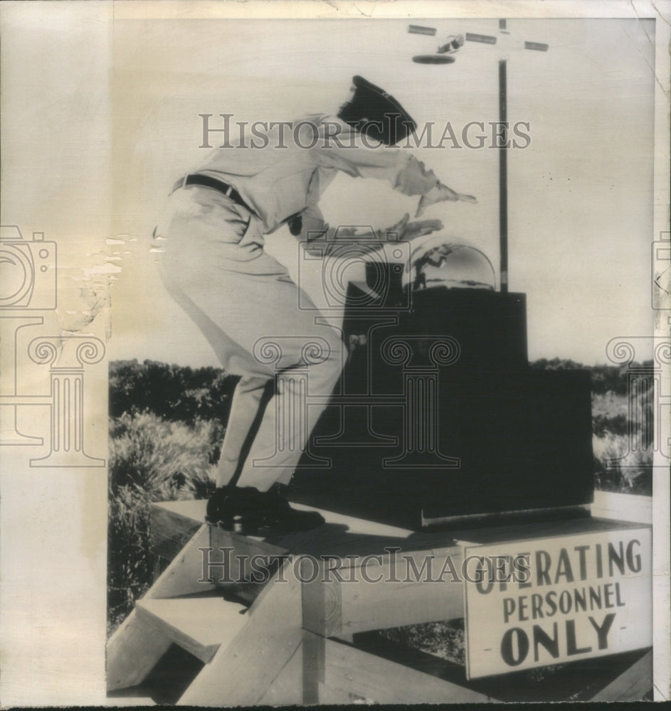 1956 Press Photo Air Force Officer Gazes Crystal Ball