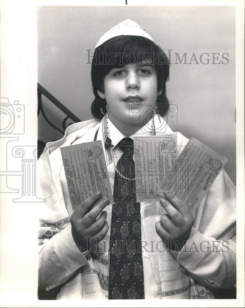 1988 Press Photo Jewish Boy Holds Letter Receipts