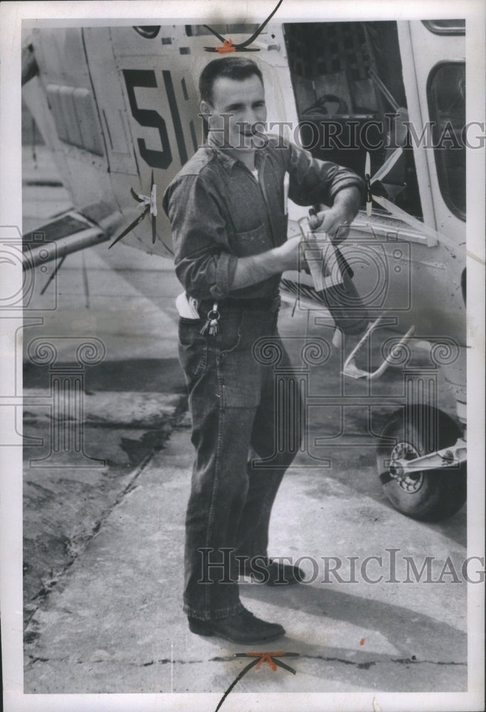 1956 Press Photo Airman Floyd Jr Loading Plane