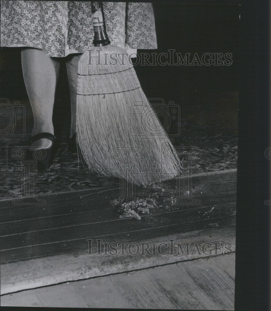 1950 Press Photo Superstitious Housewife Sweeps House