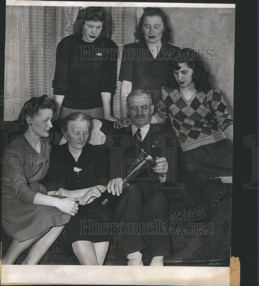 1944 Press Photo Examining Trophies