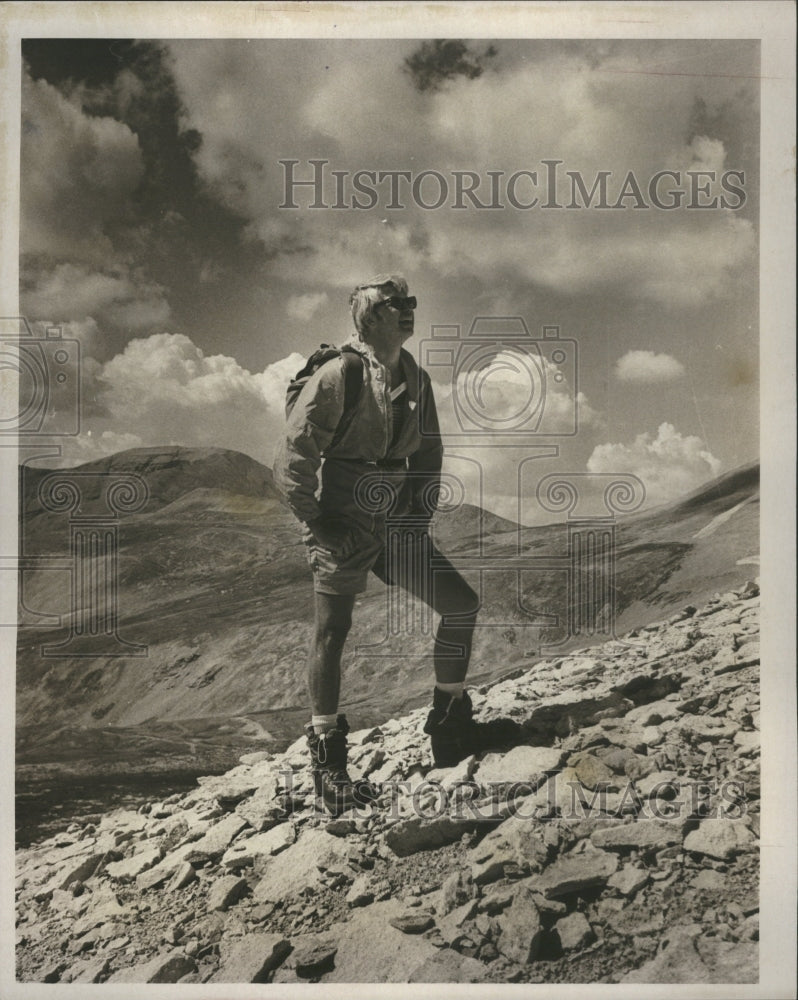 1977 Press Photo A man standing on a mountain