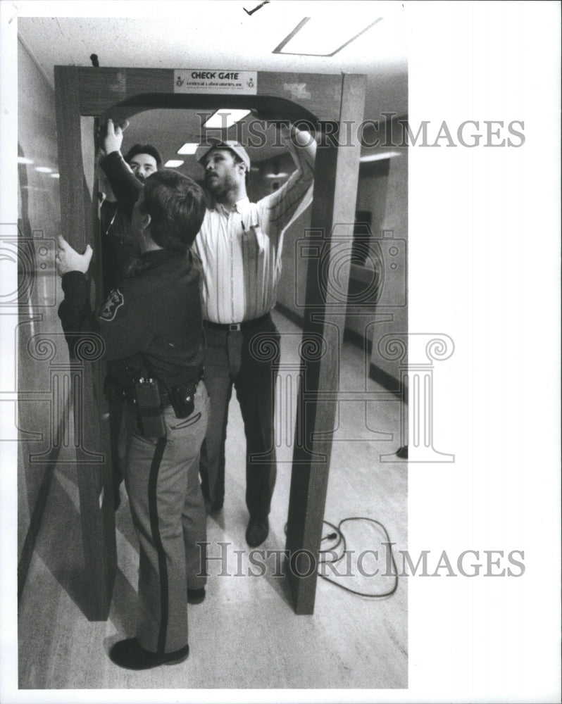 1988 Press Photo Metal Detector Being Installed Detroit