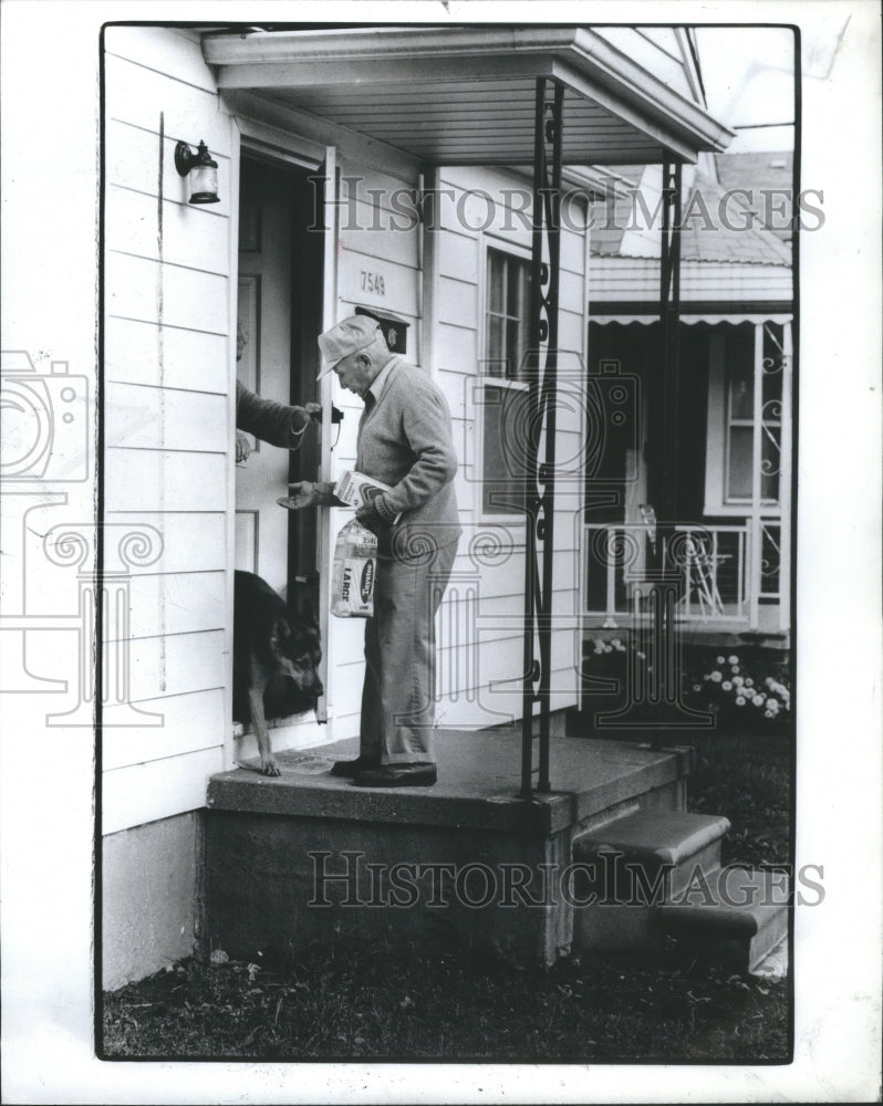 1983 Milkman Delivers Milk - Historic Images