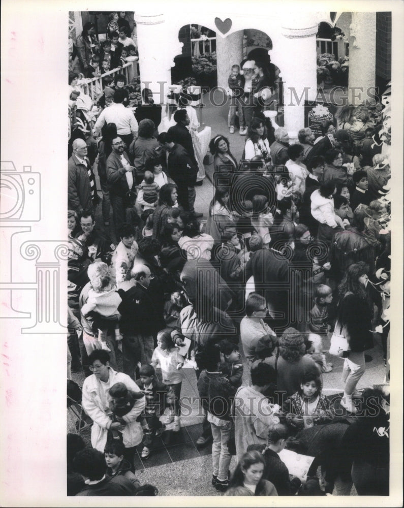 1990  waiting to see Santa Christmas shoper - Historic Images