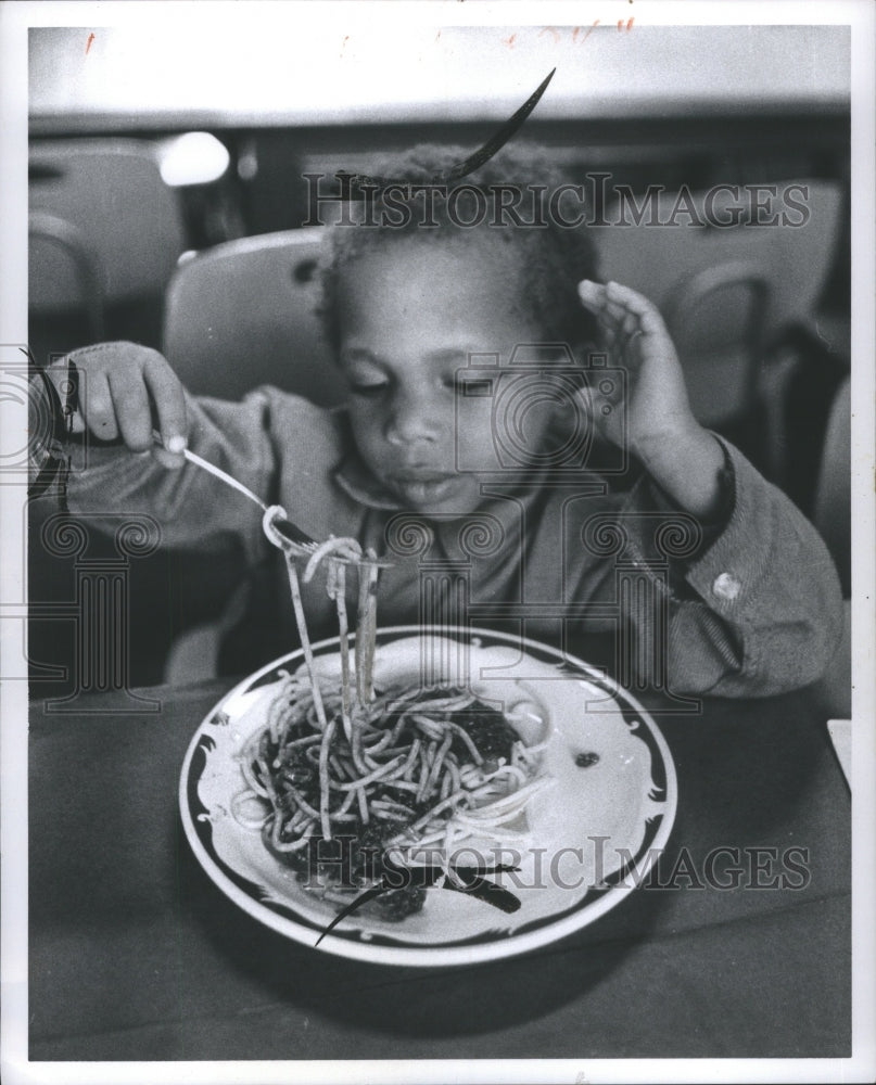 1971 Sacred Heart Child Eating Spaghetti  - Historic Images