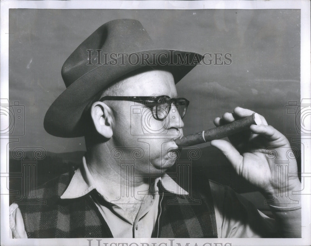 1952 Press Photo Sheriff Van Wie Puffs Wooden Whistle