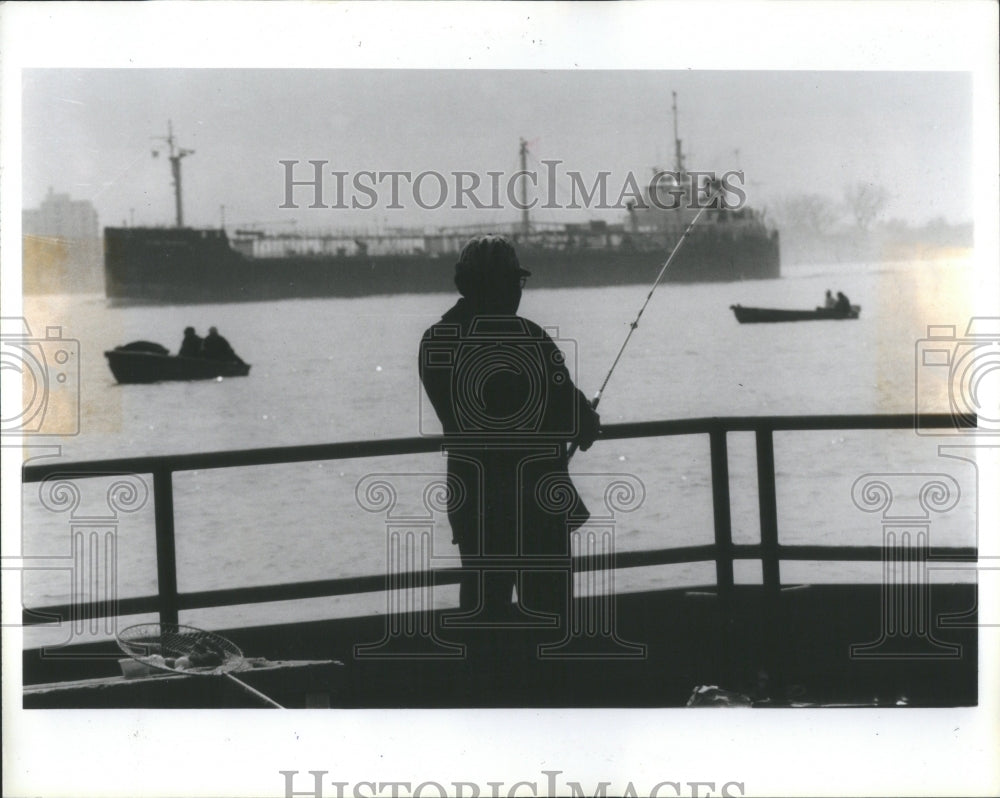 1985 Man Fishing From Pier In Detroit River - Historic Images