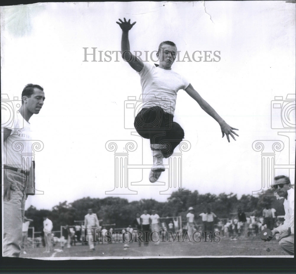 1957 Press Photo Junior Olympics Running Jump Event