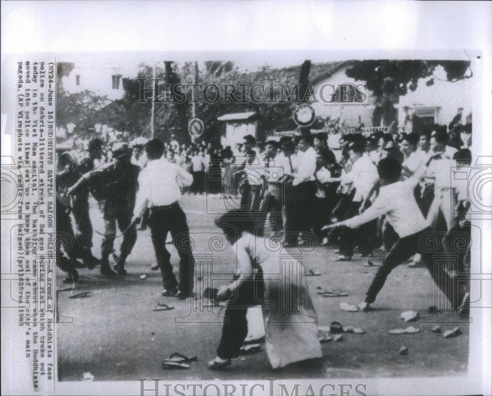 1963 Press Photo Buddhists Battle Saigon Police Debris