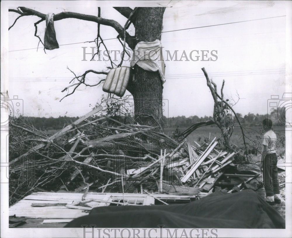 1953 Press Photo Man Surveys Home Wreckage After Storm