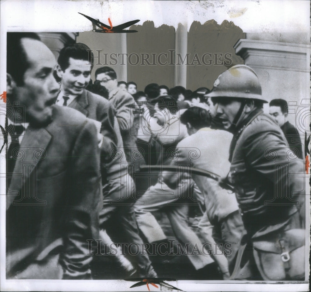 1962 Press Photo Peruvian Policeman Riots Lima Trucheon