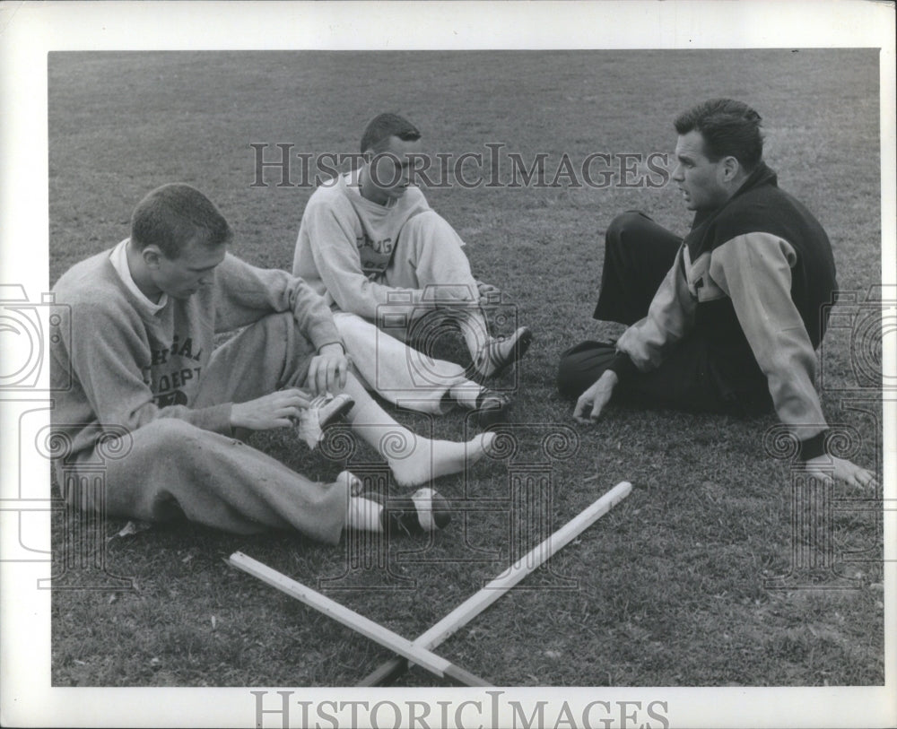 1960 Press Photo Coach Don Canham instructs players