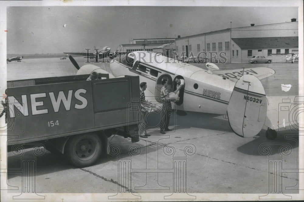 1958 Press Photo Detroit News Circulation Loading Plane