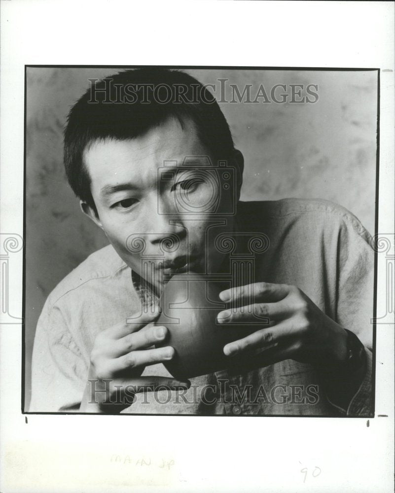 1990 Tan Dun playing the &#39;xun.&#39; - Historic Images