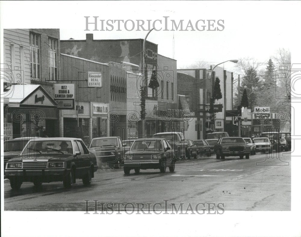 1987 Different businesses in a community - Historic Images